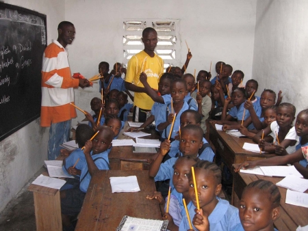 Children with pencils in Liberia