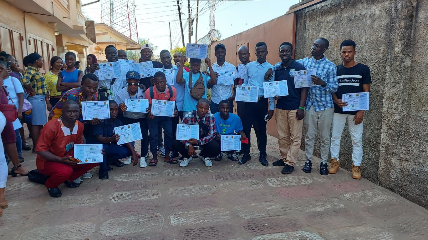 Students with their Certificate of Completion in Computer Training