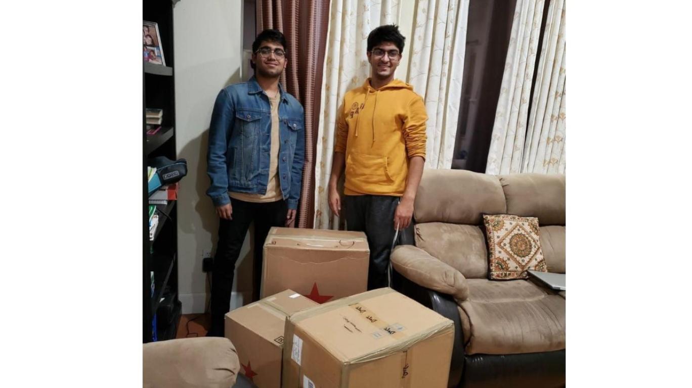Aarush & Arul collected school supplies for a school project