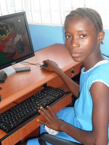 Girl getting computer training in africa