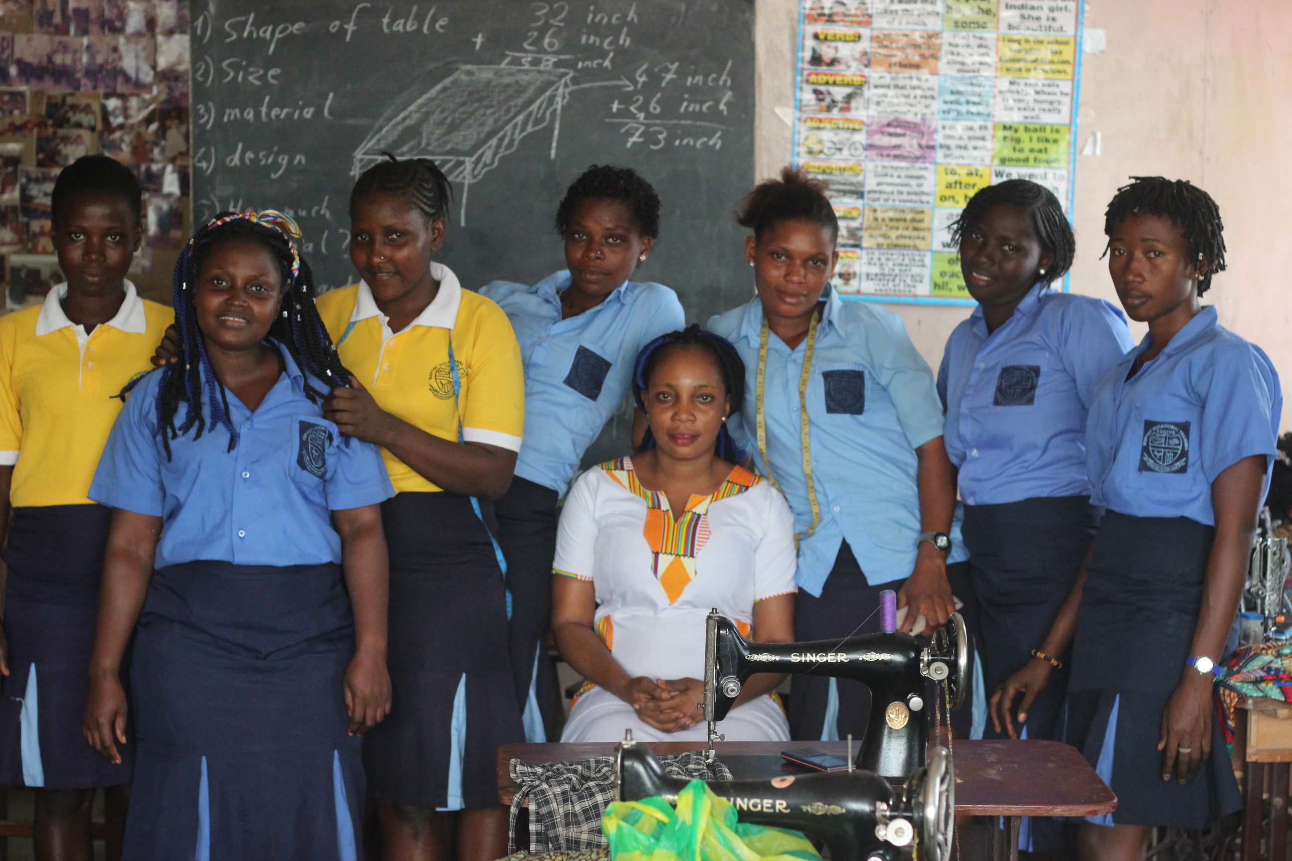 Students and their trainers in a sewing institute 