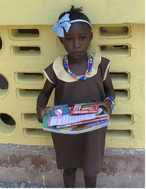 Girl with gift from sponsor