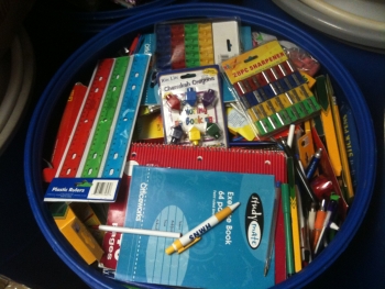 drum with books and school supplies