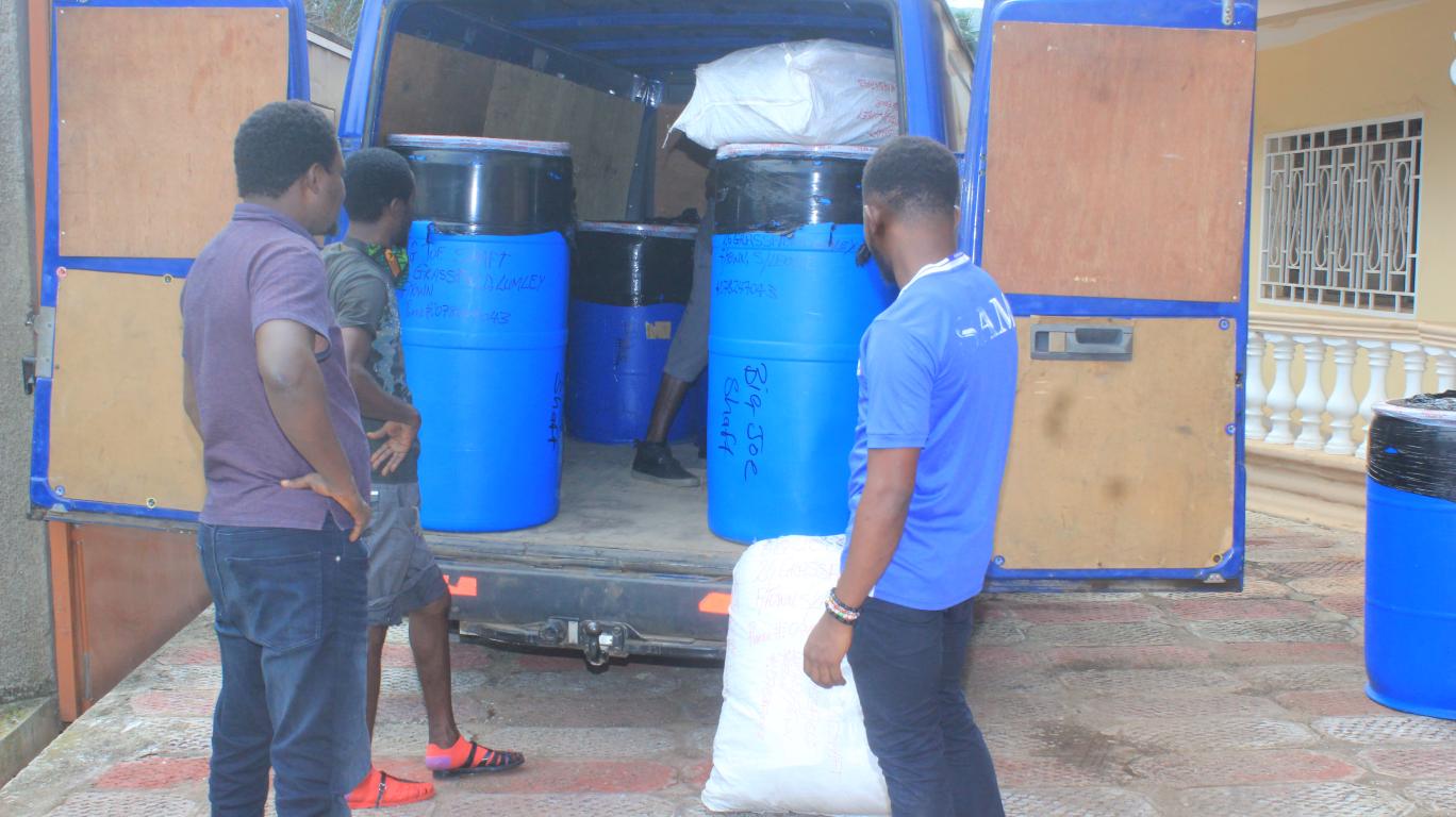 Arrival of barrels or drums of school supplies at develop africa office in Sierra Leone