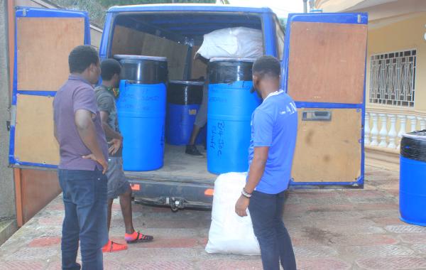 Arrival of barrels or drums of school supplies at develop africa office in Sierra Leone