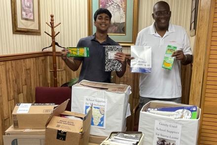 Bhargav and Sylvester with school supplies collected