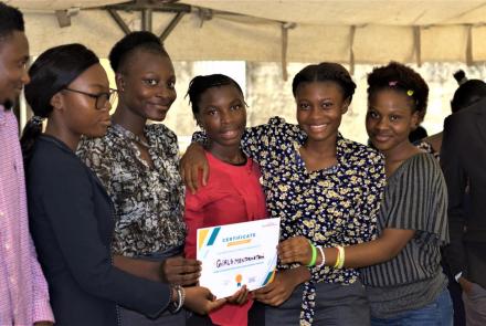 Girls holding winning certificate from Debate