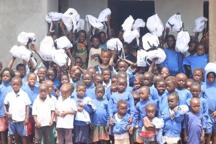 Kagbaray Students holding their new clothes & school bags